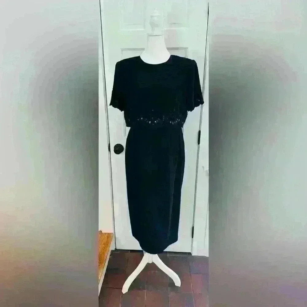 R & M Richard’s black cocktail dress, short sleeves with scallop edge. Size 12.